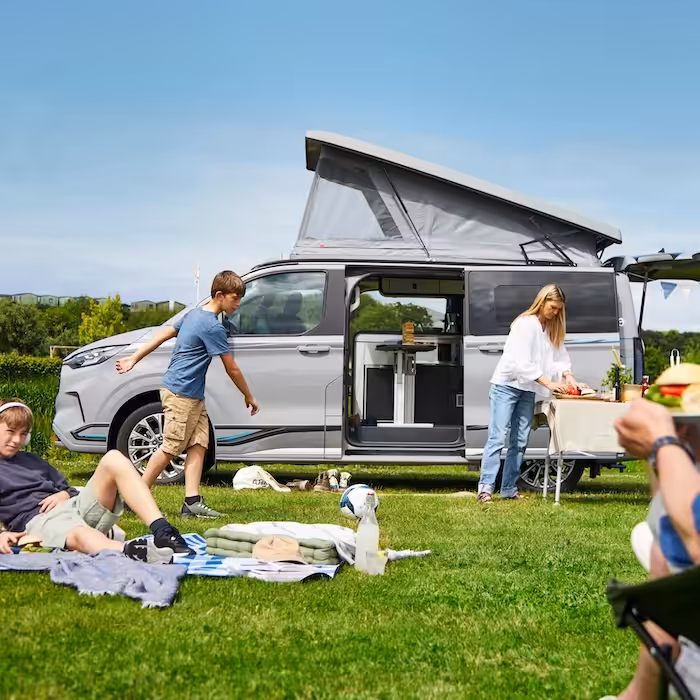 A family on holiday with a swift campervan